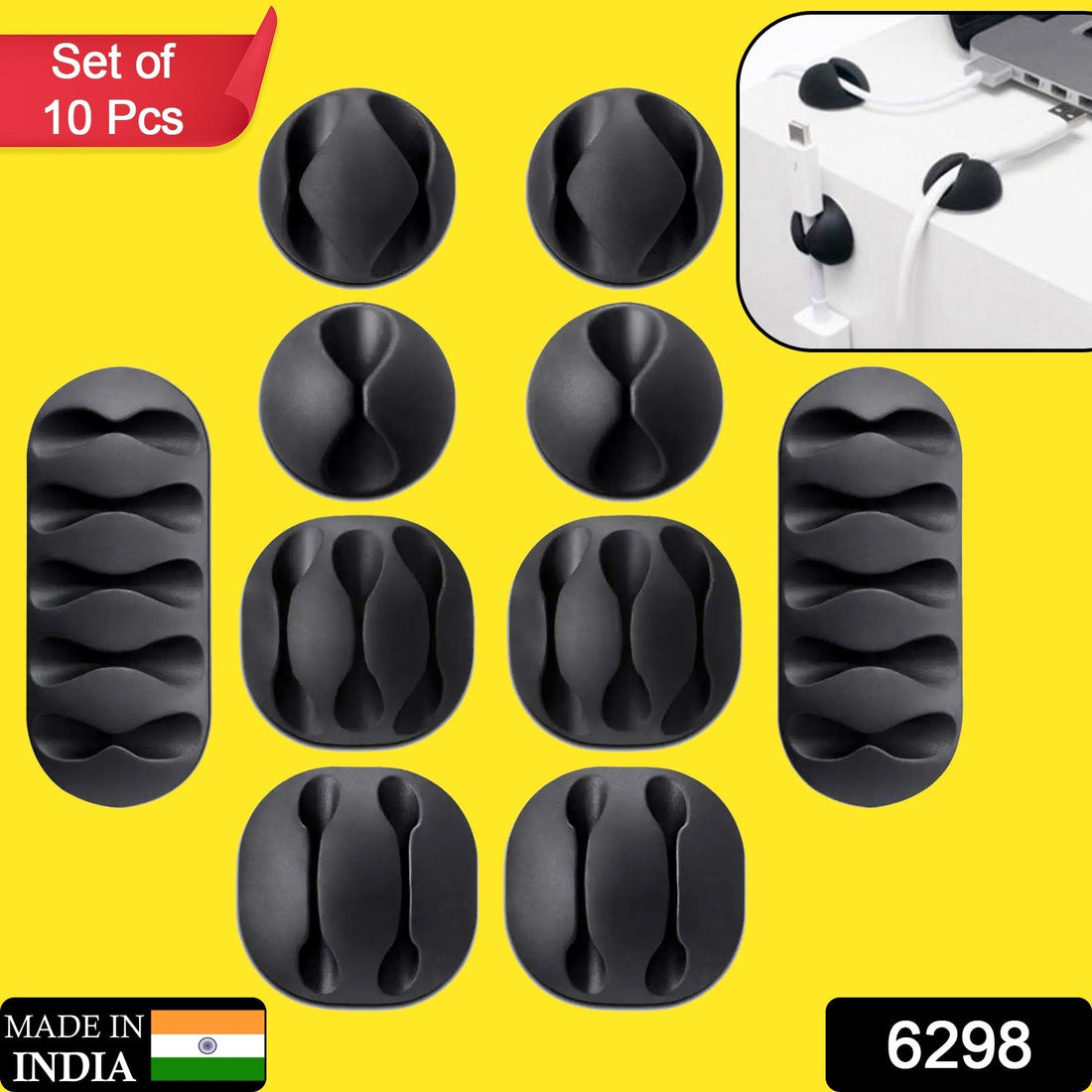 Cable organiser clips in black, shown holding multiple wires neatly on a desk.