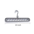 Close-up view of the nine precisely designed holes on the plastic hanger for secure garment storage.
