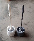 Side profile of the Pro Clean toilet cleaning brush and its compact potted holder.