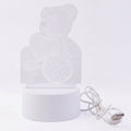 Teddy bear LED Night Lamp glowing softly in dark room