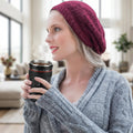 Camera lens coffee mug with its lid off, revealing the stainless steel interior.