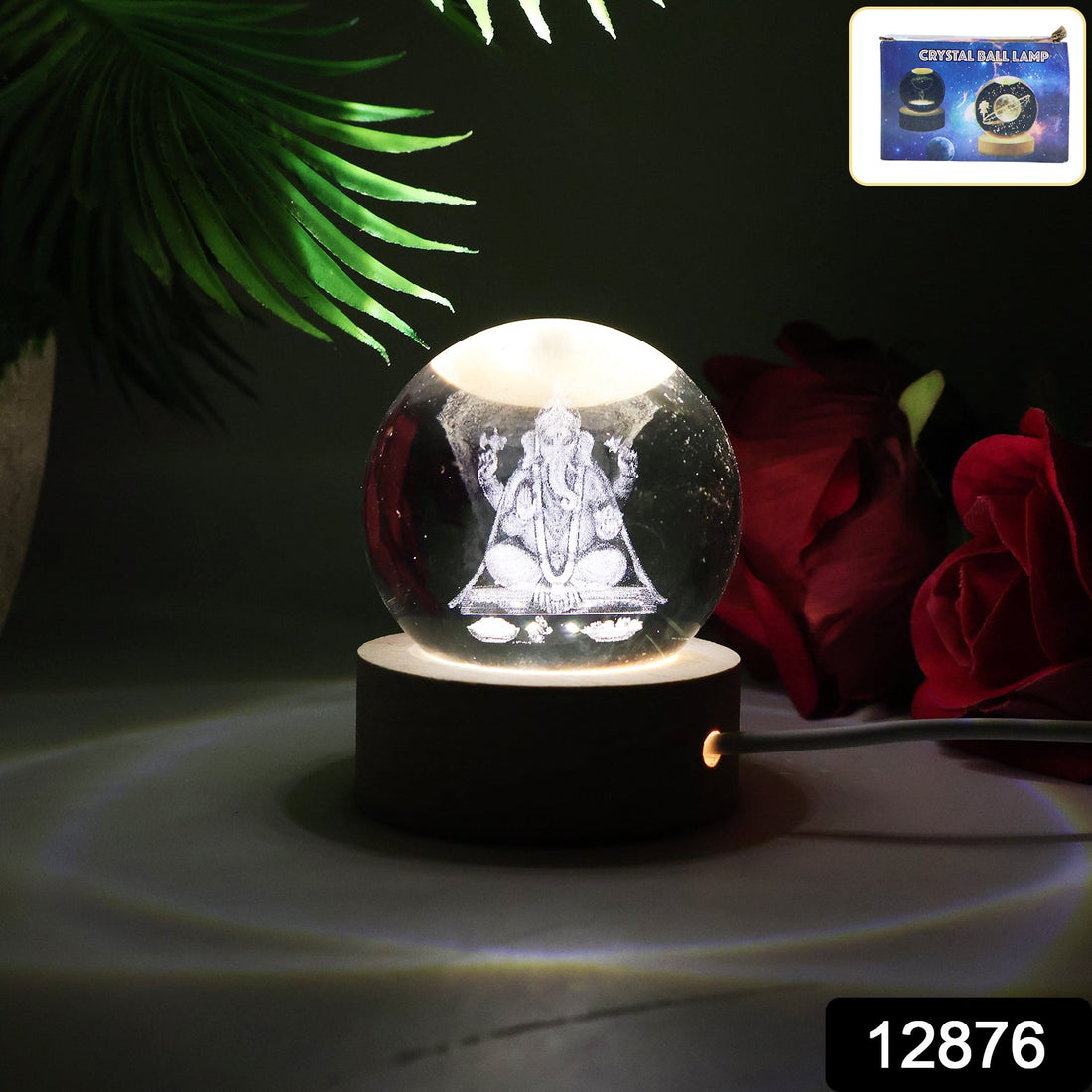 Close-up of a Ganesha 3D Crystal Ball Lamp radiating a warm glow.