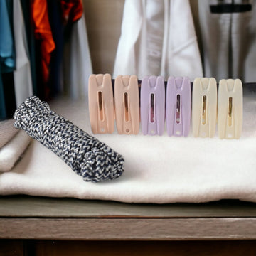 Cloth drying rope with clips hanging clothes securely outdoors
