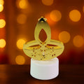 Golden LED diya candles with elegant metal finish topper on table