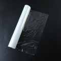 Flexible cling wrap roll with assorted food items