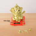 Decorative religious idol of Lord Ganesha with vibrant red base