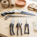 Gardening tools including pruning saw and shears for garden care