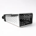 Fine and coarse grater surfaces of stainless steel 4-in-1 grater with handle