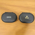 Close up of the zippered earphone pouch for secure storage.