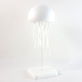 Colourful LED jellyfish lamp creating ambient lighting for home