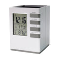 LCD display of digital desk clock showing time, date, and temperature clearly