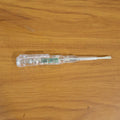 Digital voltage tester pen in use detecting a live wire with LED indication