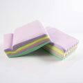 Roll of multicolor baking parchment paper sheets for cooking and baking.