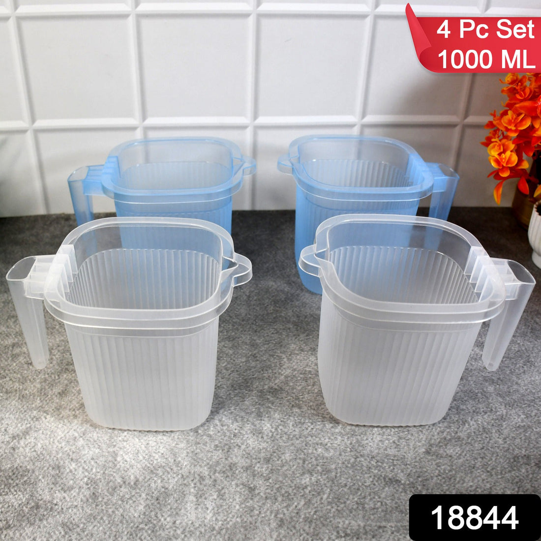 A set of four transparent plastic bathroom mugs in mixed colours, showcasing their 1000 ML capacity.