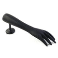 Jewelry pieces displayed elegantly on black hand-shaped stand