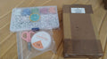 Neatly organized DIY bracelet making kit in a clear storage box