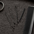 Detailed close-up of black bobby pin with smooth tips