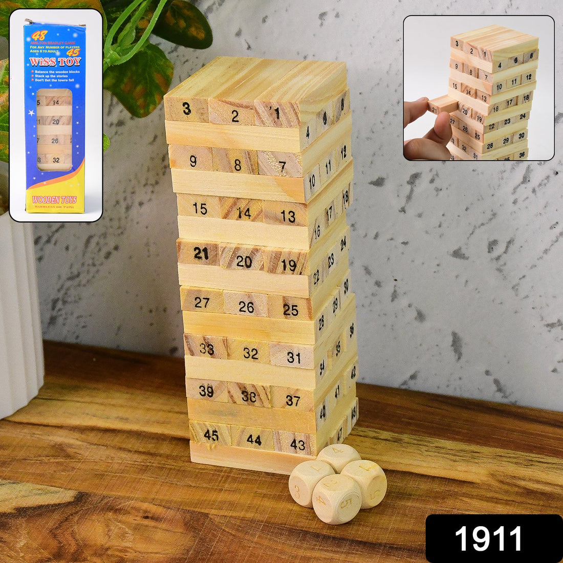 A tall tower of natural wooden blocks with dice, ready for a challenging Wooden Stacking Game.