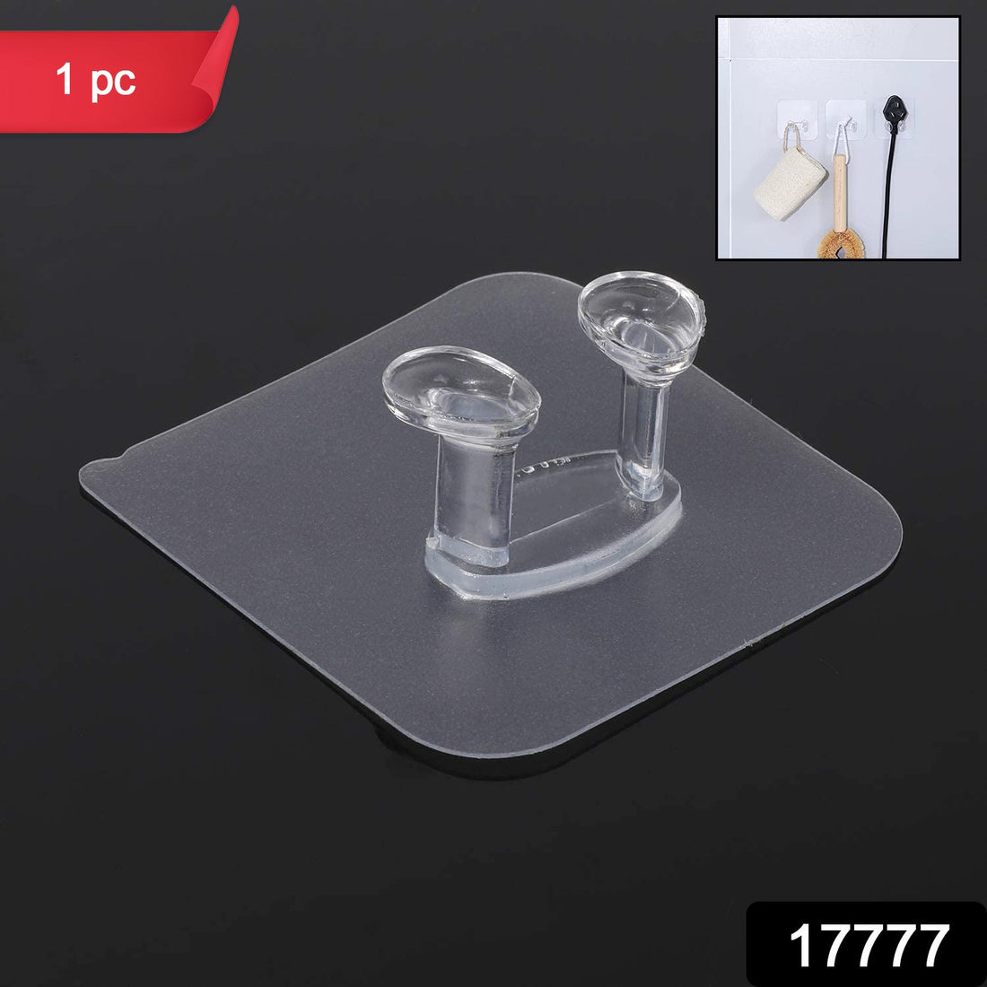 Transparent self-adhesive wall hook mounted on a clean, smooth wall.