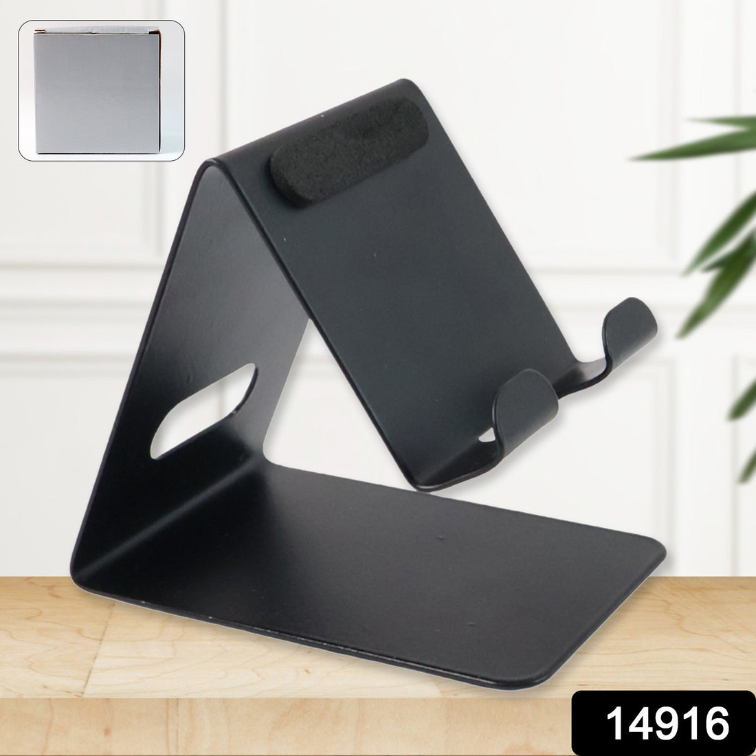 Universal metal mobile and tablet stand holder placed on desk for hands-free use