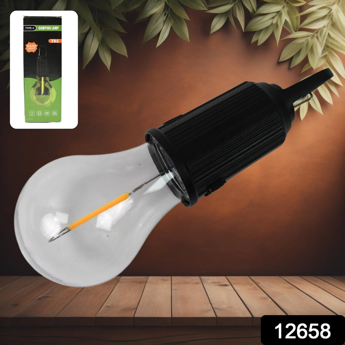 A black and clear portable LED tent light with an orange filament stands on a light wooden pedestal against a bright yellow
