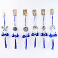 Detailed view of evil eye metal bell wind chime for house protection